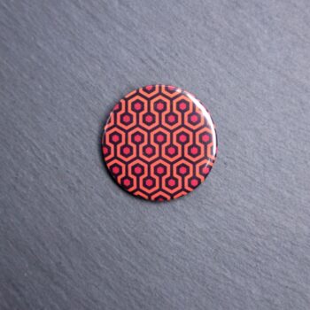 Shining Carpet Button. These buttons are made with photo paper, metal round, and metal backing. These buttons are vibrant and fun to use on bags or vests.