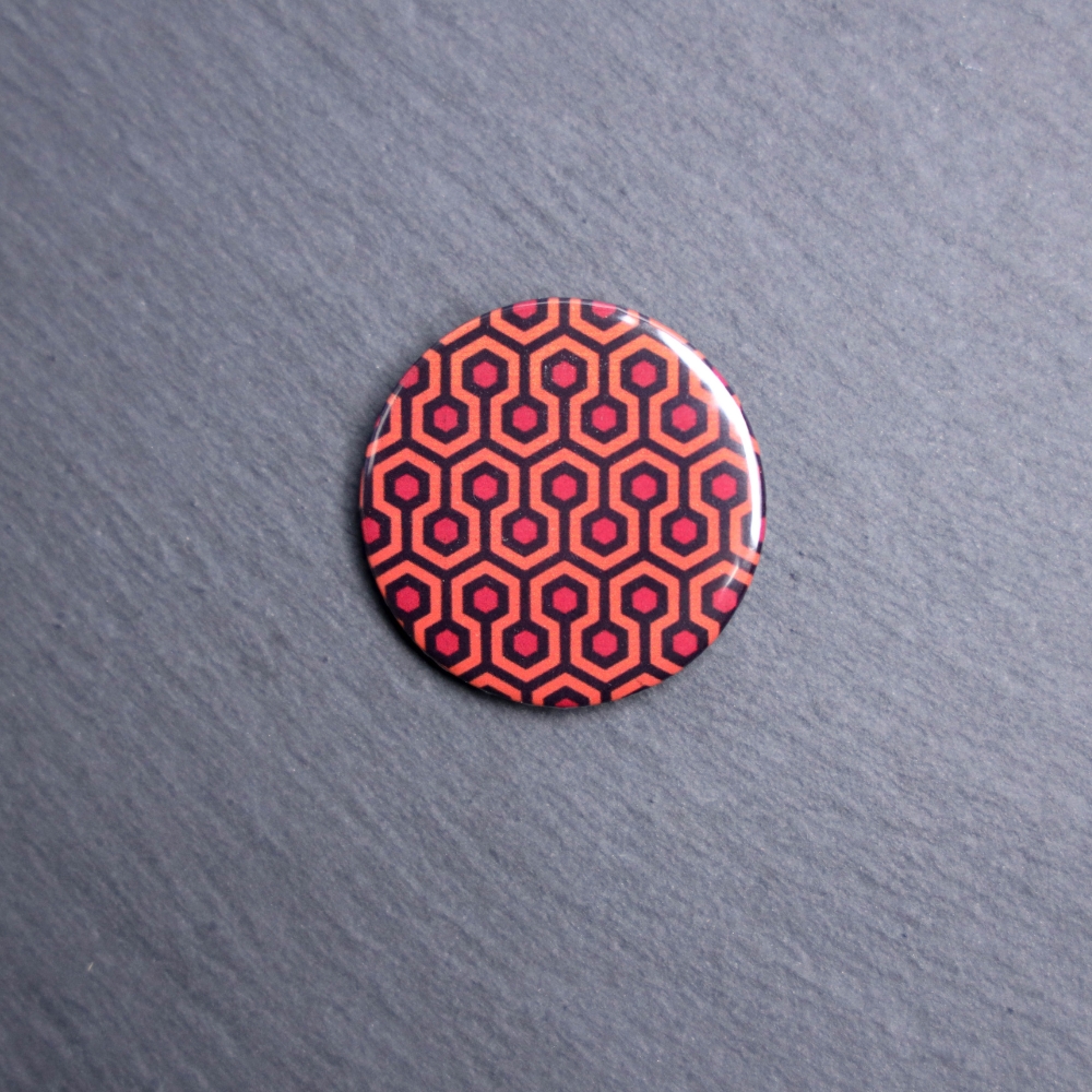Shining Carpet Button. These buttons are made with photo paper, metal round, and metal backing. These buttons are vibrant and fun to use on bags or vests.
