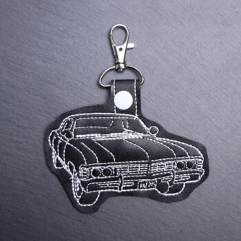 Supernatural Impala Snap Bag Tag. This bag tag is made with faux vinyl and embroidered. Comes with lobster clasp topper that easily hooks to a bag, zippers