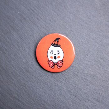 Vintage Ghost Button. These buttons are made with photo paper, metal round, and metal backing. These buttons are vibrant and fun to use on bags or vests.