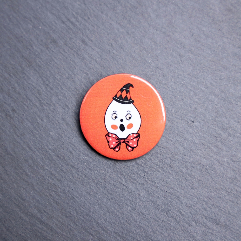 Vintage Ghost Button. These buttons are made with photo paper, metal round, and metal backing. These buttons are vibrant and fun to use on bags or vests.