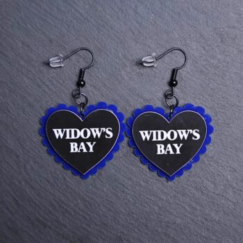 Widow's Bay Pillow Earrings that are white, black and blue. These earrings are made with engraved acrylic. Comes with black hooks that is nickel free.