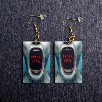 AHS Poster Earrings. These earrings are made with acrylic and hand heat pressed. Comes with 18k plated gold hooks that is nickel free.