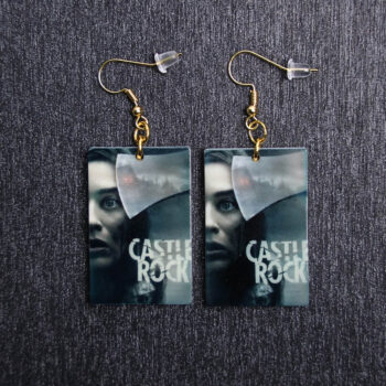 Castle Rock Poster Earrings. These earrings are made with acrylic and hand heat pressed. Comes with 18k plated gold hooks that is nickel free.