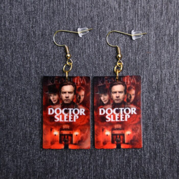 Doctor Sleep Poster Earrings. These earrings are made with acrylic and hand heat pressed. Comes with 18k plated gold hooks that is nickel free.