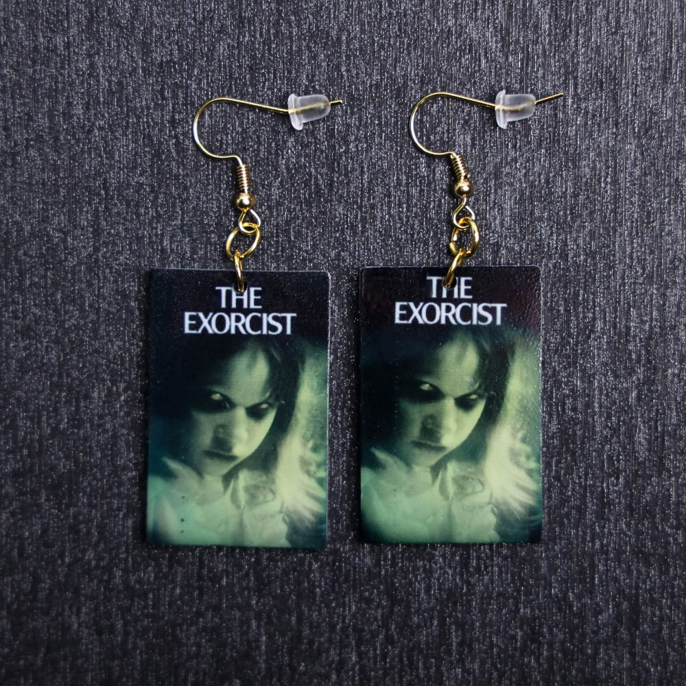 Exorcist Poster Earrings. These earrings are made with acrylic and hand heat pressed. Comes with 18k plated gold hooks that is nickel free.
