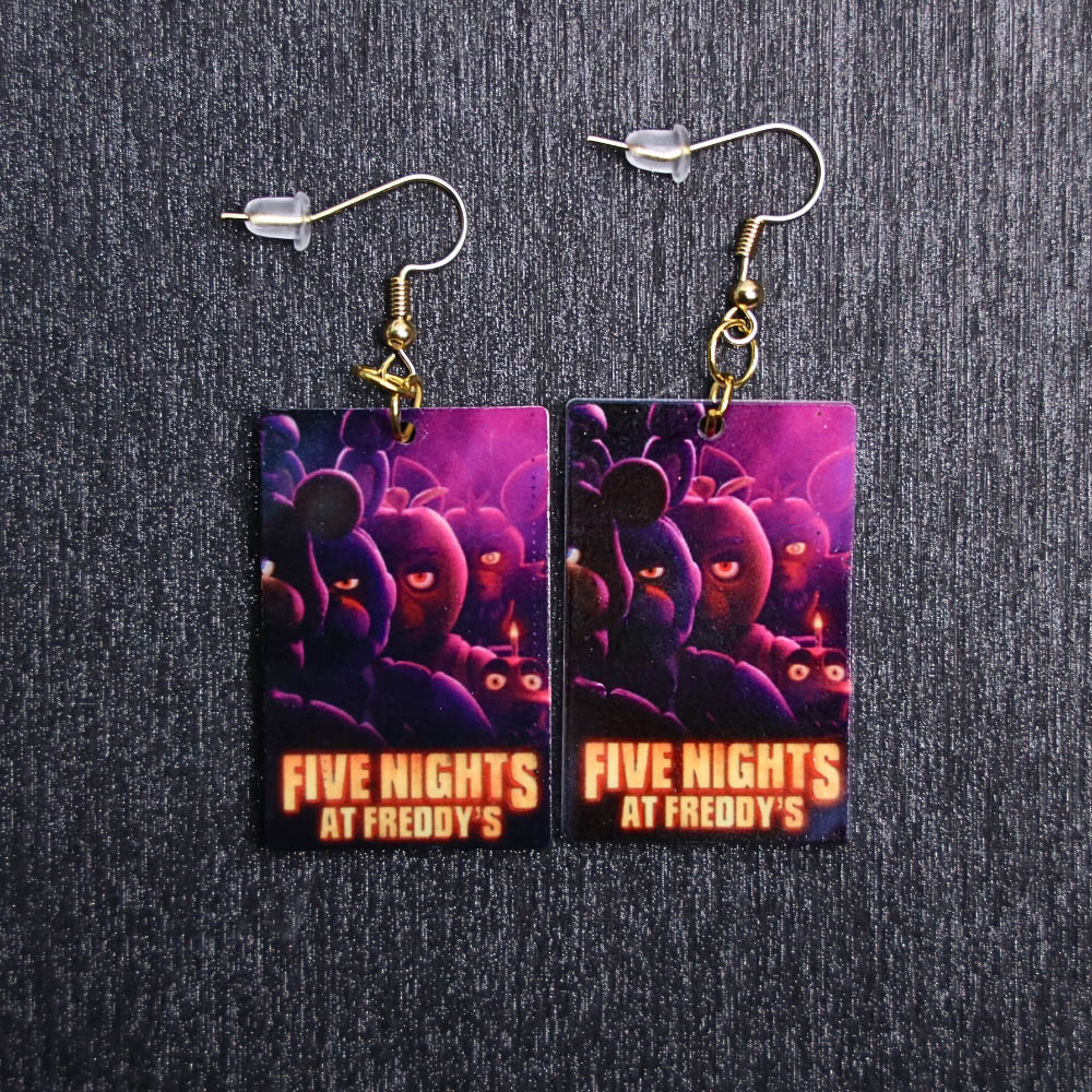 Five Nights At Freddy's Poster Earrings. These earrings are made with acrylic and hand heat pressed. Comes with 18k plated gold hooks that is nickel free.