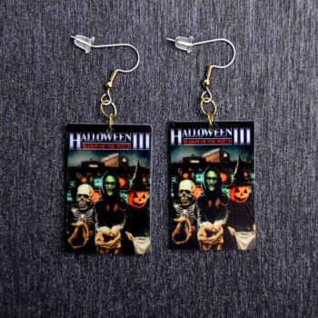 Halloween III Poster Earrings. These earrings are made with acrylic and hand heat pressed. Comes with 18k plated gold hooks that is nickel free.