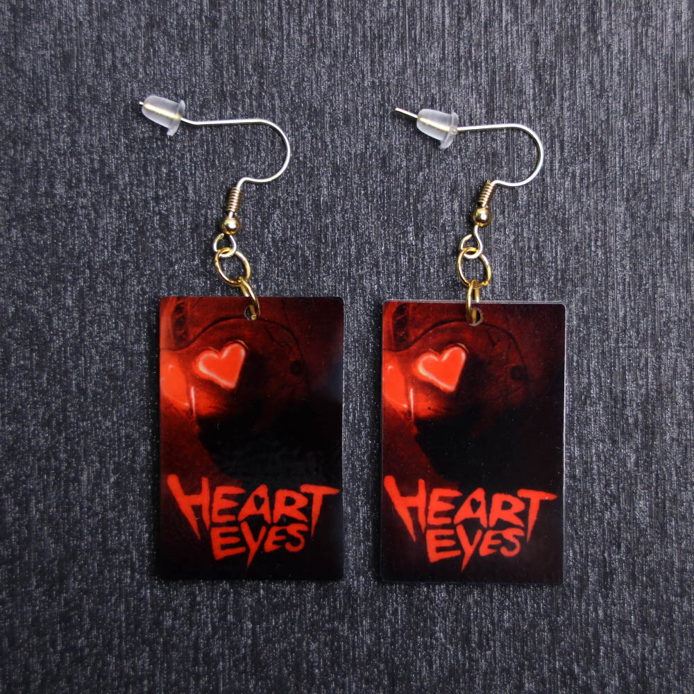 Heart Eyes Poster Earrings. These earrings are made with acrylic and hand heat pressed. Comes with 18k plated gold hooks that is nickel free.