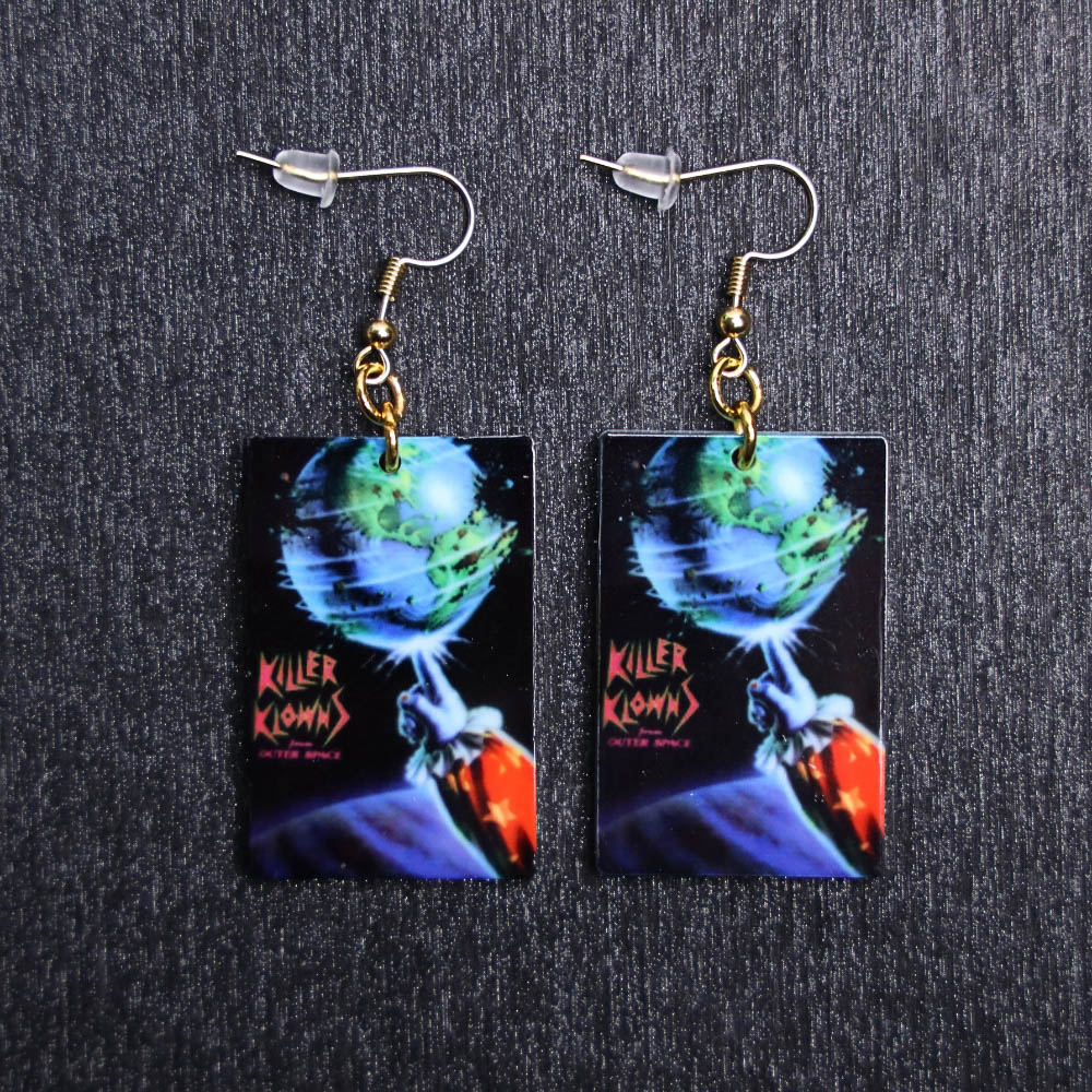 Killer Klowns Poster Earrings. These earrings are made with acrylic and hand heat pressed. Comes with 18k plated gold hooks that is nickel free.