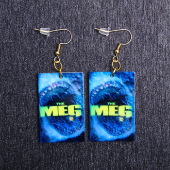 Meg Poster Earrings. These earrings are made with acrylic and hand heat pressed. Comes with 18k plated gold hooks that is nickel free.