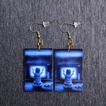 Poltergeist Poster Earrings. These earrings are made with acrylic and hand heat pressed. Comes with 18k plated gold hooks that is nickel free.