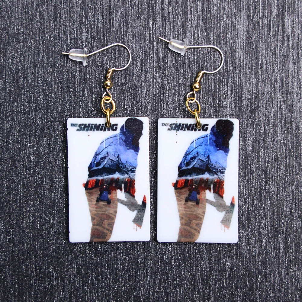 Shining Poster Earrings. These earrings are made with acrylic and hand heat pressed. Comes with 18k plated gold hooks that is nickel free.
