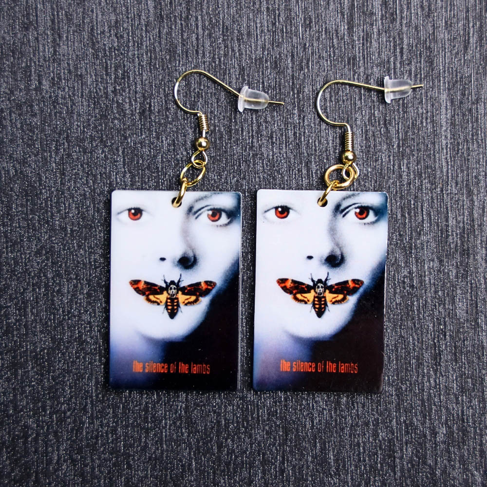 Silence Of The Lambs Poster Earrings. These earrings are made with acrylic and hand heat pressed. Comes with 18k plated gold hooks that is nickel free.