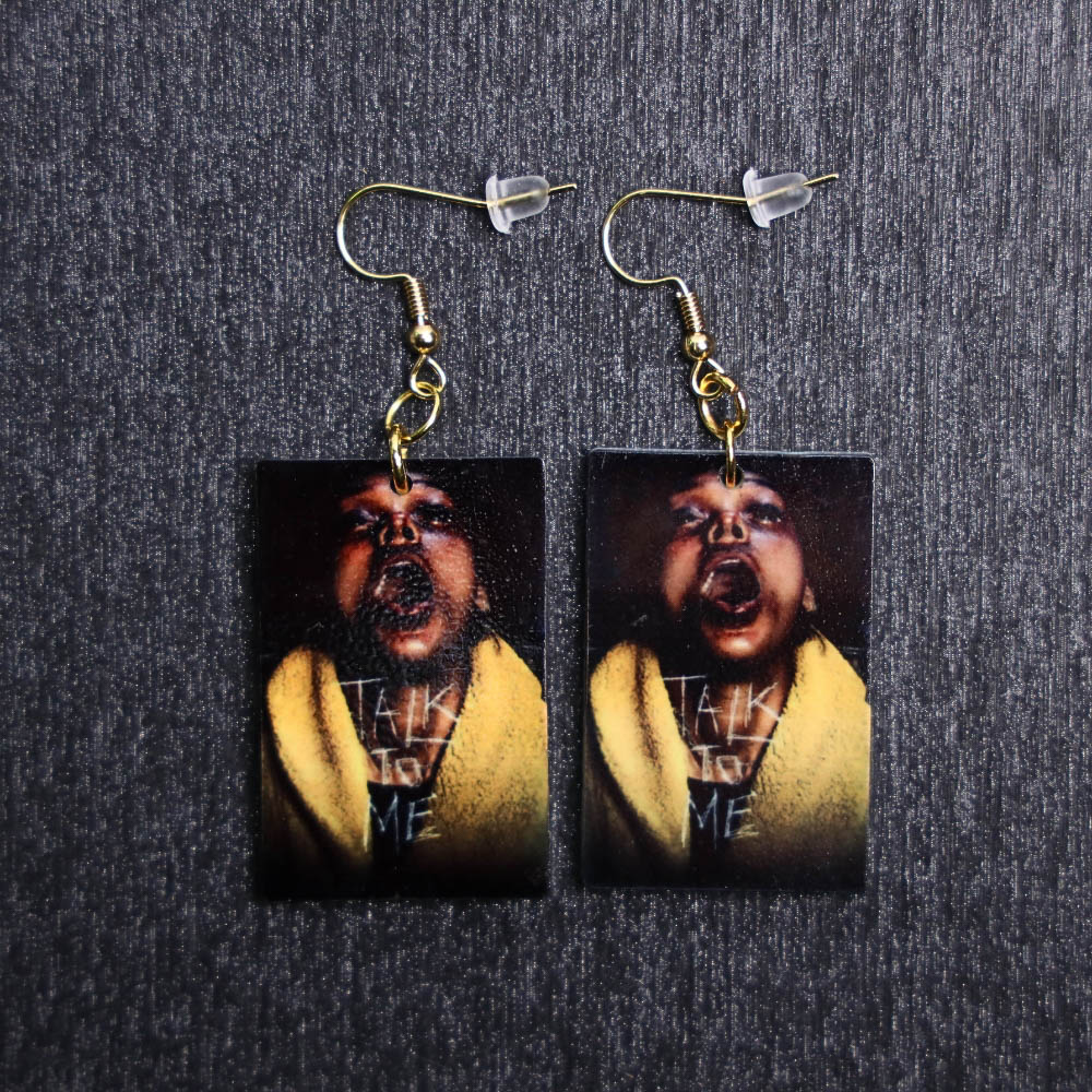 Talk To Me Poster Earrings. These earrings are made with acrylic and hand heat pressed. Comes with 18k plated gold hooks that is nickel free.