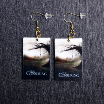 The Conjuring Poster Earrings. These earrings are made with acrylic and hand heat pressed. Comes with 18k plated gold hooks that is nickel free.