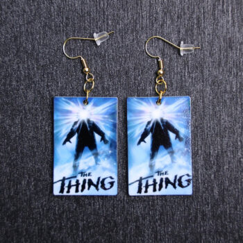 Thing Poster Earrings. These earrings are made with acrylic and hand heat pressed. Comes with 18k plated gold hooks that is nickel free.