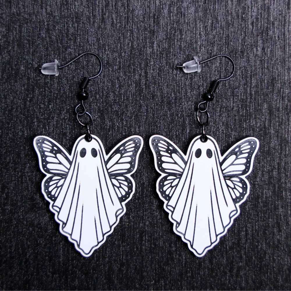 Ghost Butterfly Earrings. These earrings are made with white to black acrylic. Comes with black hooks that is nickel free.