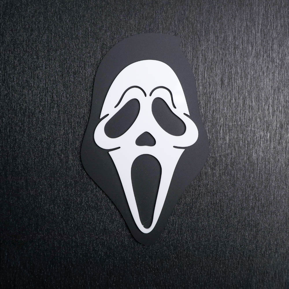 Ghostface White Sign. This sign is made with black matte acrylic base and a white acrylic topper. Comes with attachable keyhole.