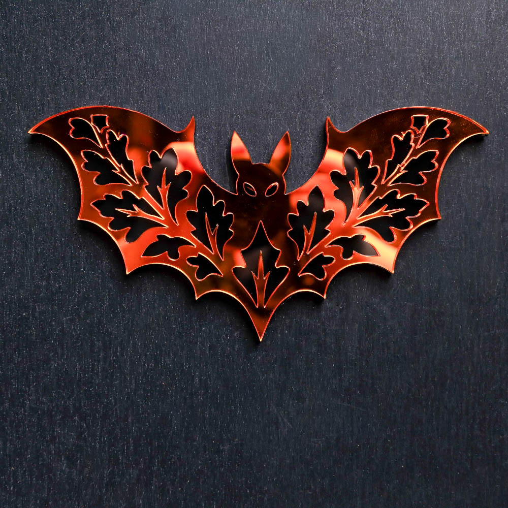 Fall Bat Orange Mirror Sign. This sign is made with black acrylic base and a orange mirror top layer. Comes with attachable keyhole.