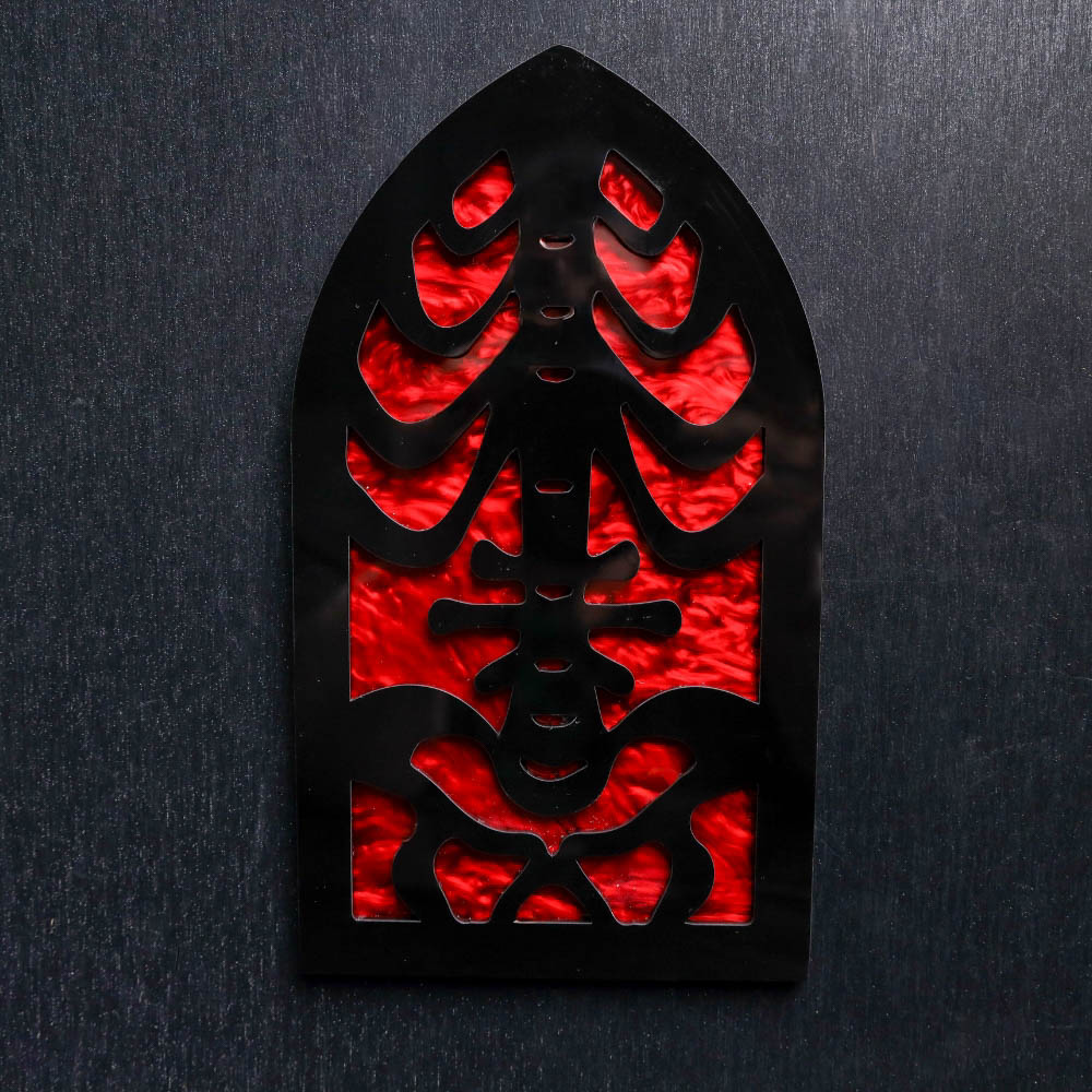 Skeleton Rib Cage Red Pearl Sign. This sign is made with red pearl acrylic base and a black acrylic top layer. Comes with attachable keyhole.