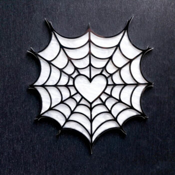Spider Web Heart White Pearl Sign. This sign is made with white pearl acrylic base and a black acrylic top layer. Comes with attachable keyhole.