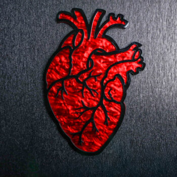 Anatomical Heart Red Pearl Sign. This sign is made with red pearl acrylic base and a black acrylic top layer. Comes with attachable keyhole.