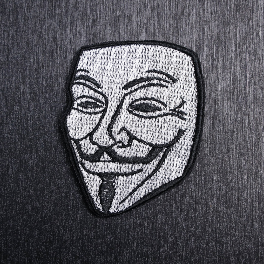 Guy Fawkes Patch Sew On in white and black. Beautifully embroidered design which is sew on design. Just sew or glue with E6000 glue onto your favorite bag, vest, or clothing.