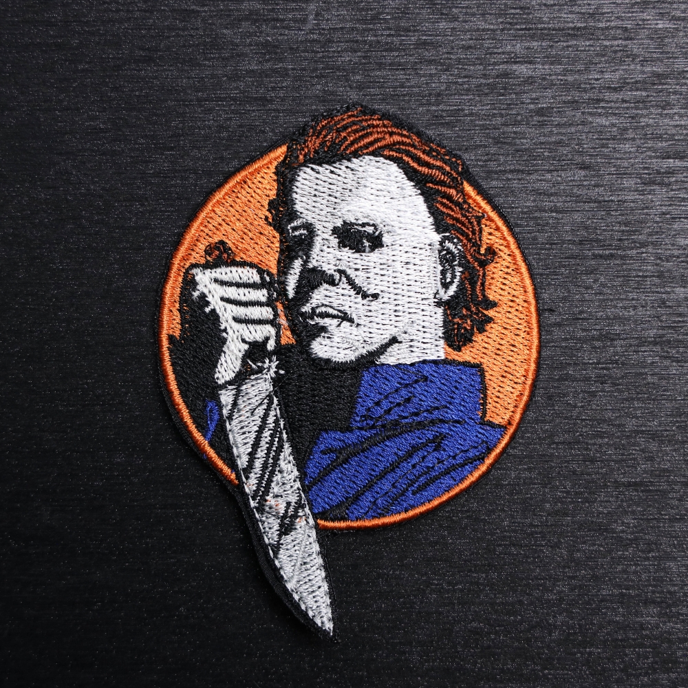 Michael Myers Patch Sew On in orange, blue, black, silver, and white. Beautifully embroidered design which is sew on design. Just sew or glue with E6000 glue