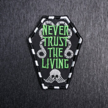Never Trust The Living Patch Sew On in white, green, and black. Beautifully embroidered design which is sew on design. Just sew or glue with E6000 glue onto your favorite bag, vest, or clothing.